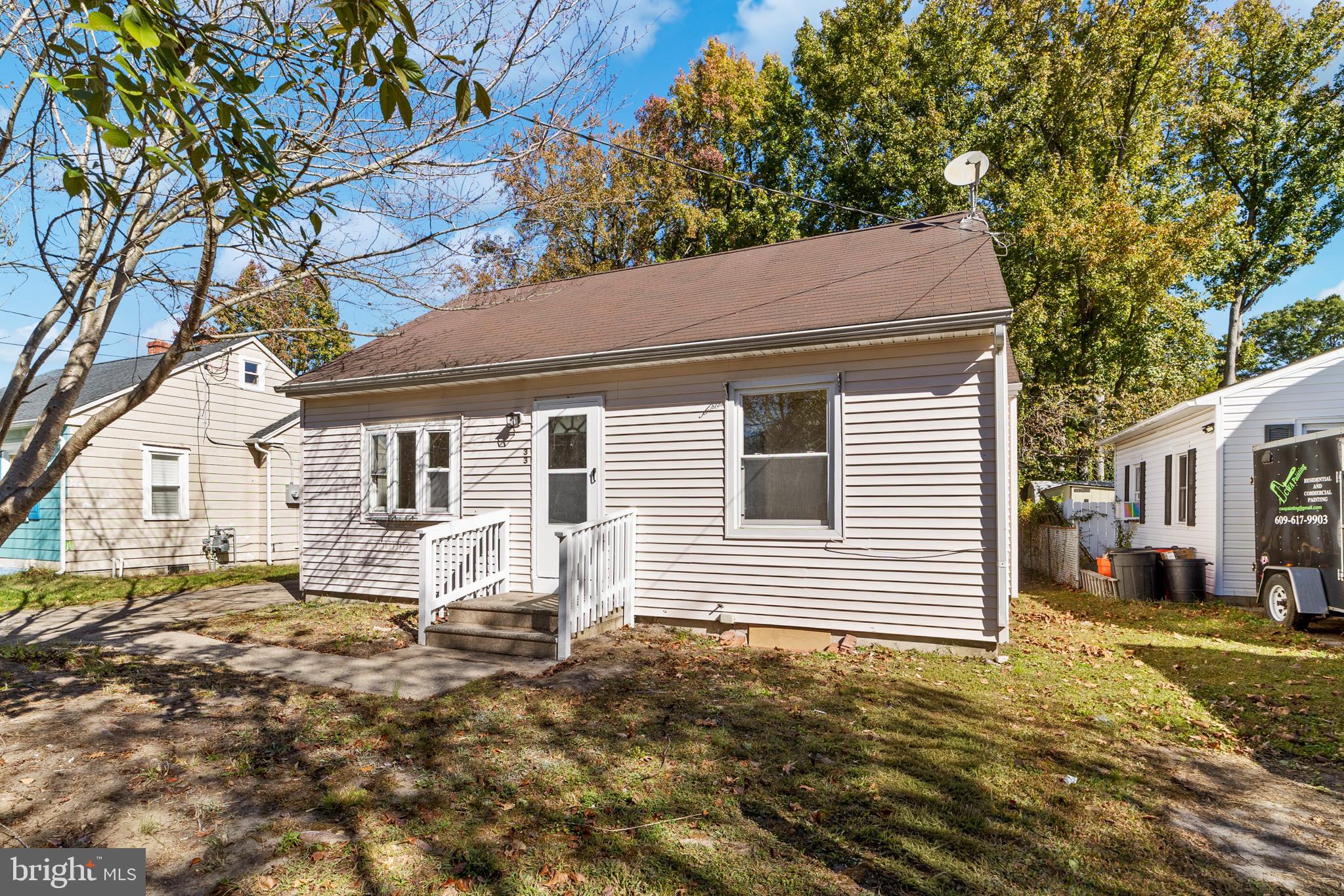 33 Pinewood Avenue Carneys Point, NJ 08069 - Photo 2 of 24 a front view of a house with a yard
