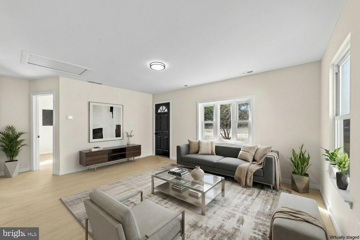 33 Pinewood Avenue Carneys Point, NJ 08069 - Photo 3 of 22 a living room with furniture and a large window