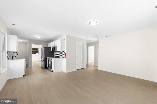 a view of an empty room with a sink