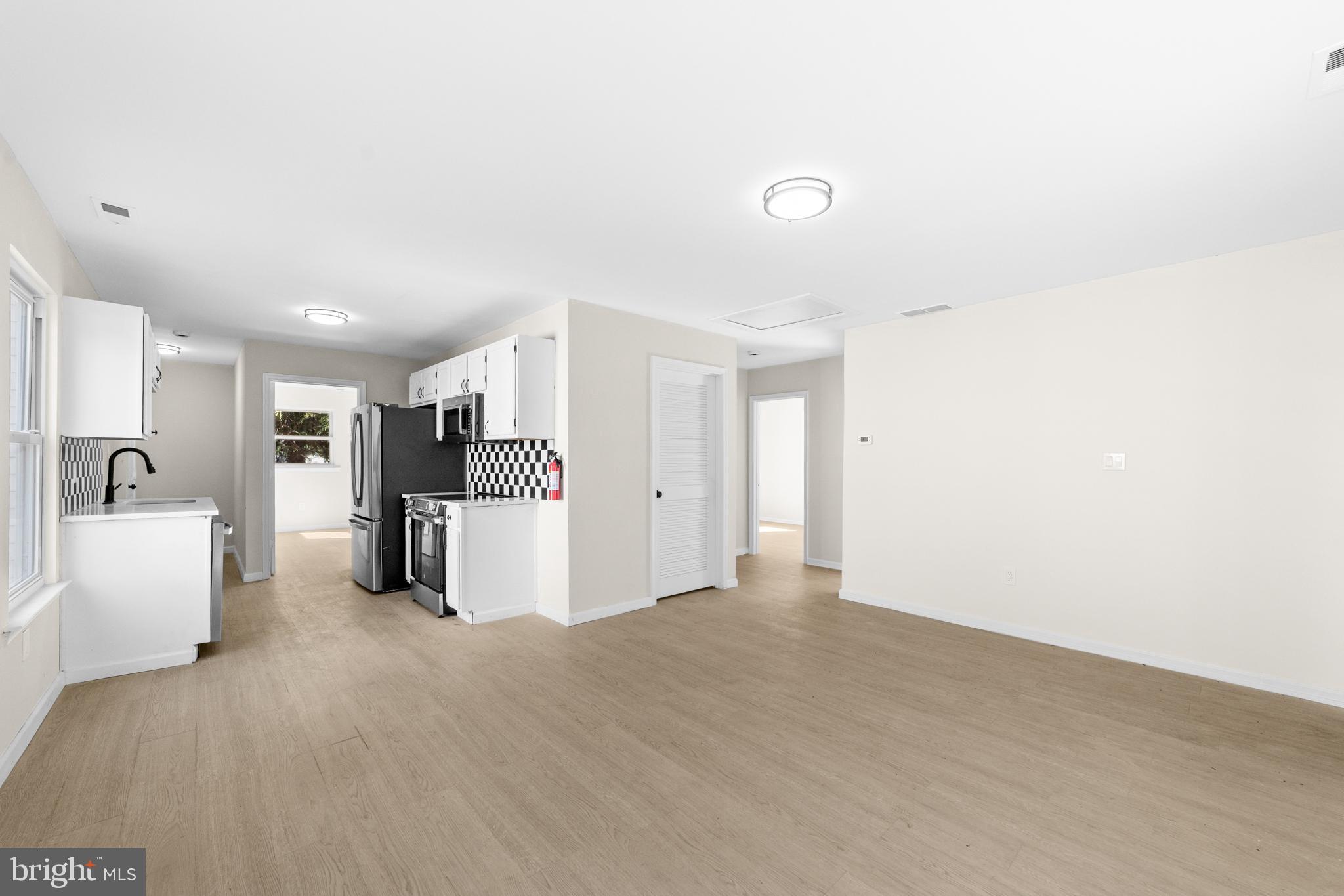 33 Pinewood Avenue Carneys Point, NJ 08069 - Photo 4 of 24 a view of an empty room with a sink