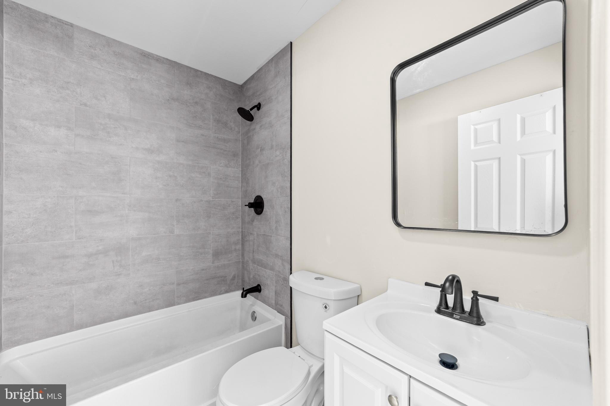 33 Pinewood Avenue Carneys Point, NJ 08069 - Photo 10 of 24 a bathroom with a sink toilet and shower