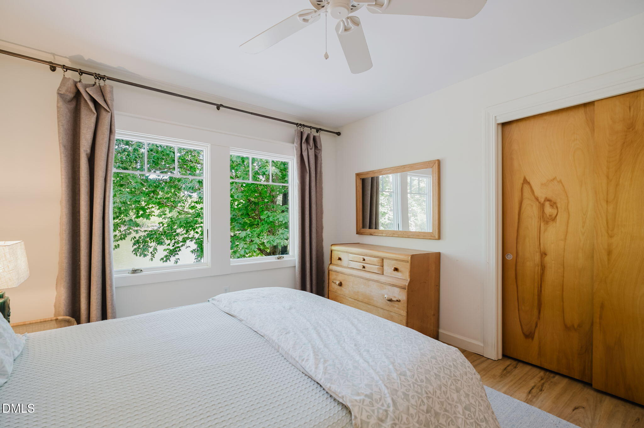 370 Robinson Ferry Road Macon, NC 27551 - Photo 52 of 85 a bedroom with a bed dresser and a window