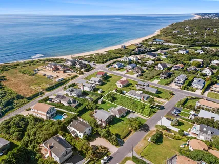 an aerial view of residential houses with outdoor space