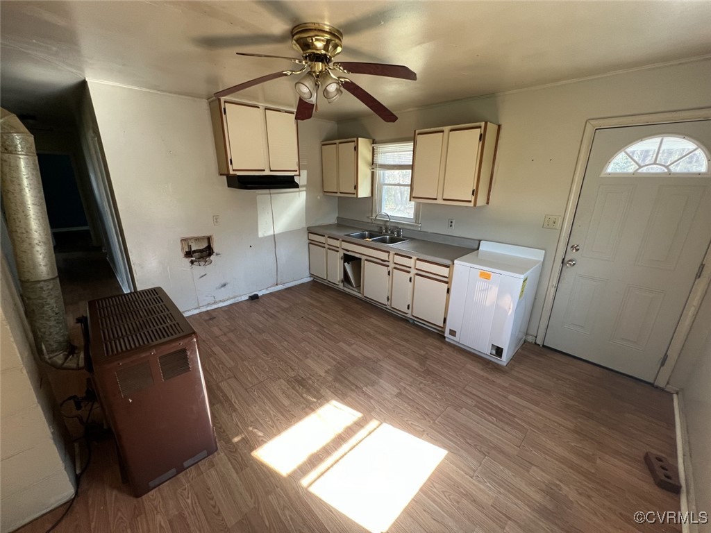 2502 Dry Bread Road Emporia, VA 23847 - Photo 9 of 14 a kitchen with stainless steel appliances granite countertop a stove top oven a sink a dining table and chairs with wooden floor