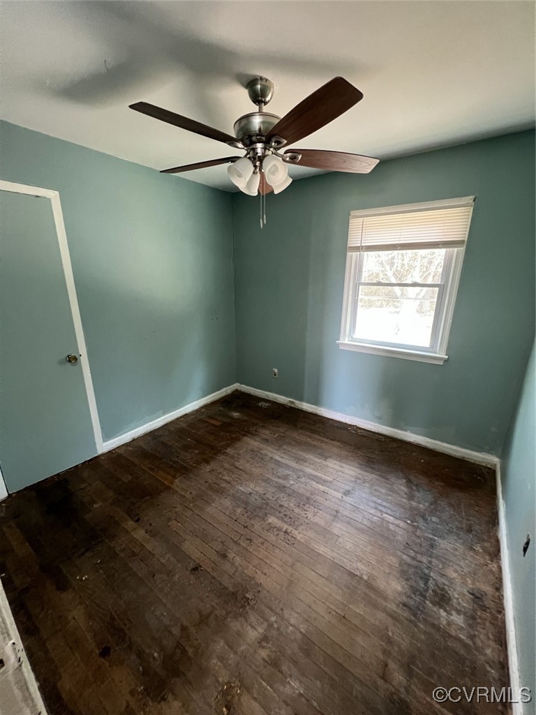 2502 Dry Bread Road Emporia, VA 23847 - Photo 10 of 14 en empty room with windows and fan