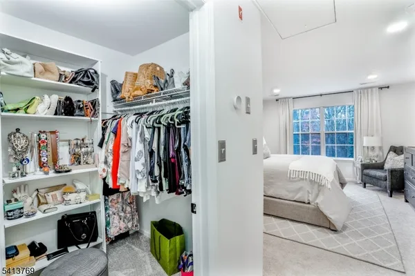 a bed room with a bed and a window