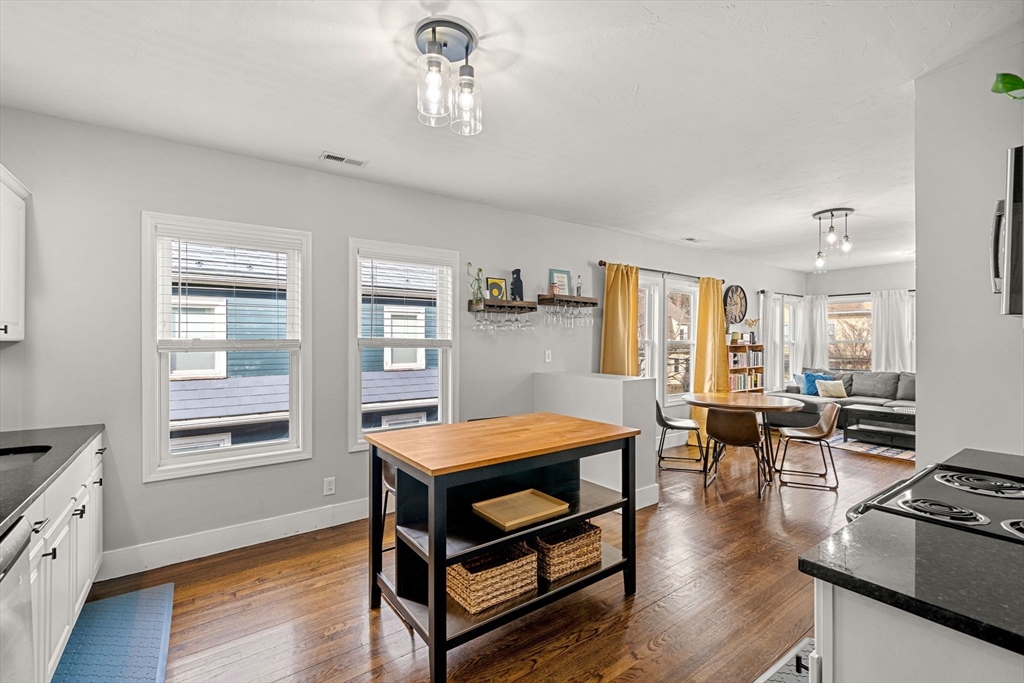 104 Stetson Avenue, Unit 2 Swampscott, MA 01907 - Photo 13 of 33 a living room with furniture and wooden floor