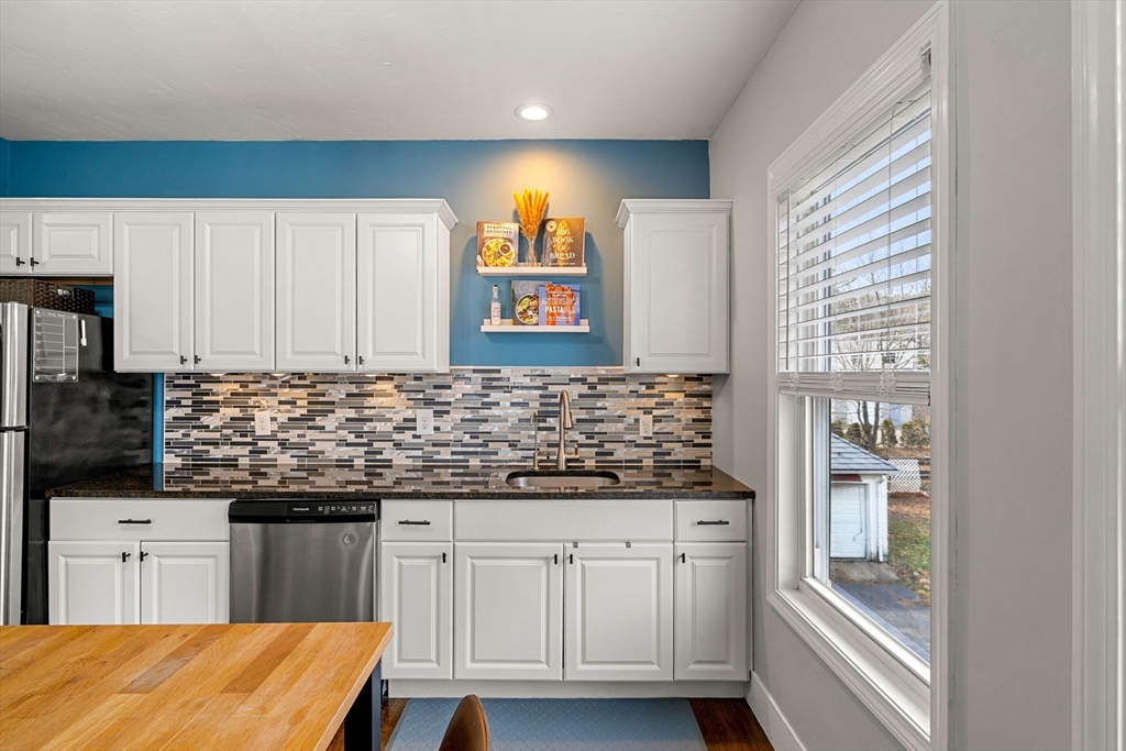 104 Stetson Avenue, Unit 2 Swampscott, MA 01907 - Photo 14 of 33 a kitchen with stainless steel appliances granite countertop a stove a sink and a microwave