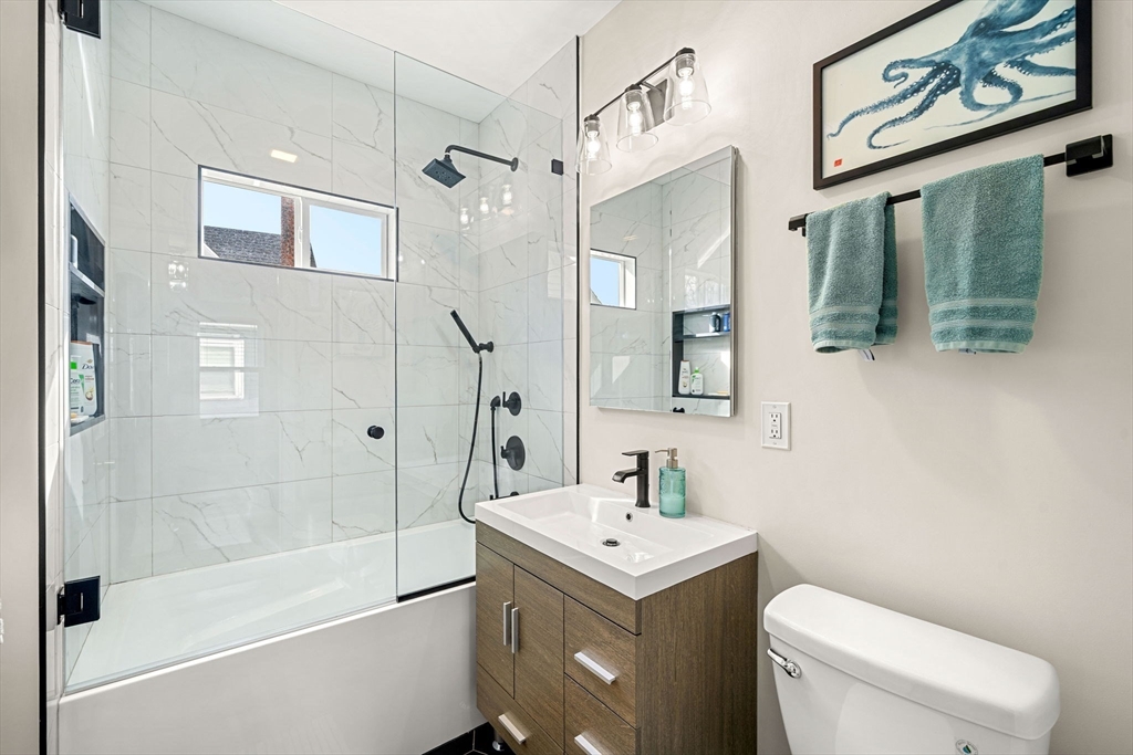 104 Stetson Avenue, Unit 2 Swampscott, MA 01907 - Photo 17 of 33 a bathroom with a sink a toilet and shower