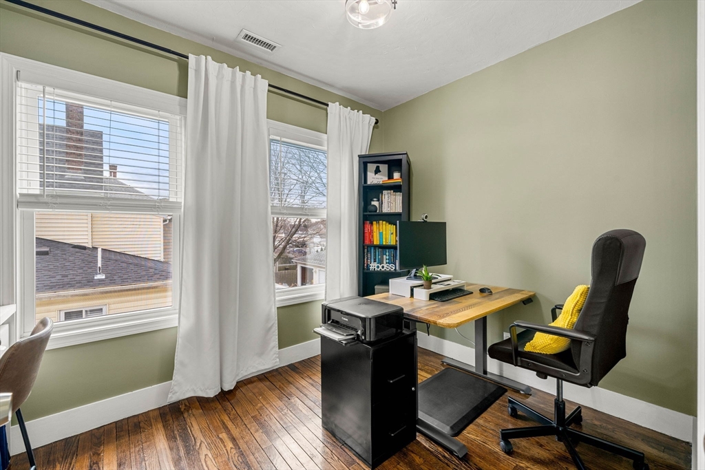 104 Stetson Avenue, Unit 2 Swampscott, MA 01907 - Photo 18 of 33 a view of a workspace with furniture and a window