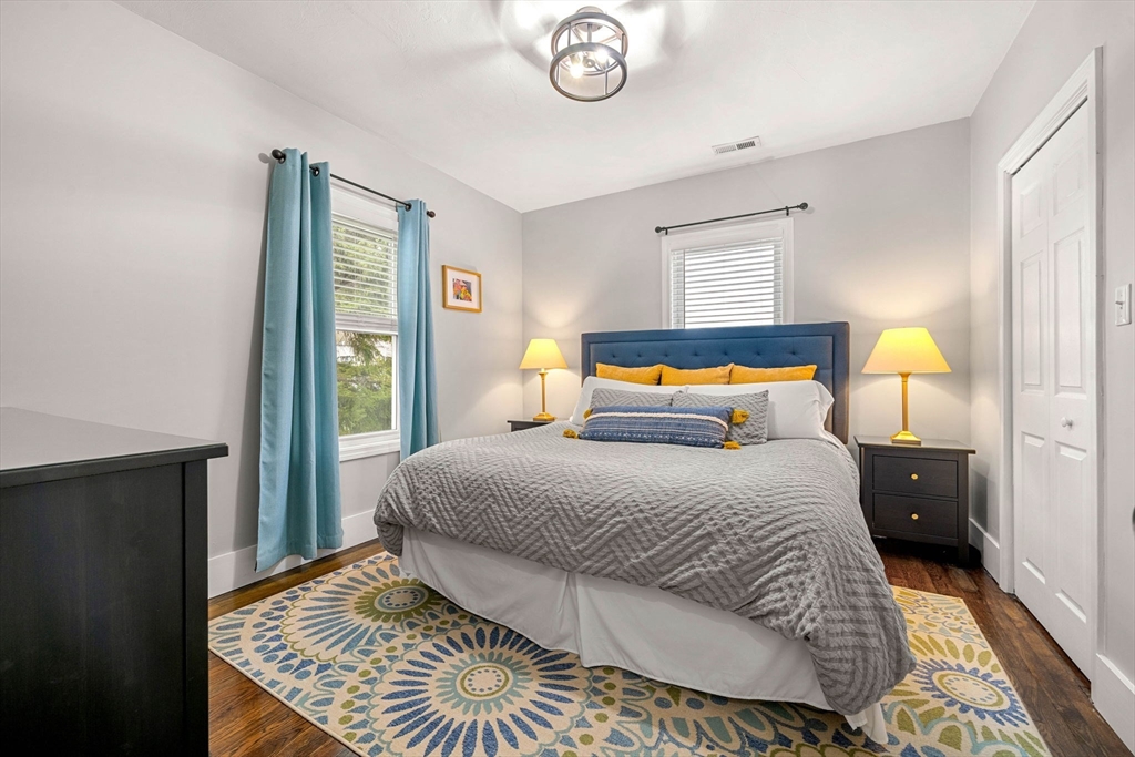 104 Stetson Avenue, Unit 2 Swampscott, MA 01907 - Photo 22 of 33 a bedroom with a bed and wooden floor
