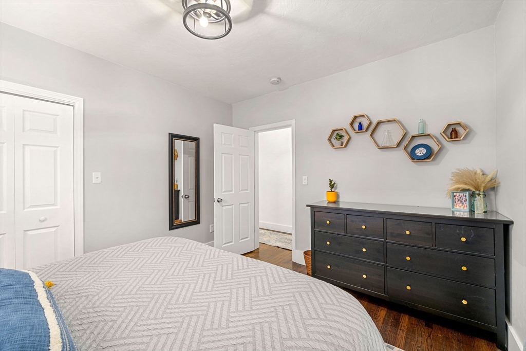 104 Stetson Avenue, Unit 2 Swampscott, MA 01907 - Photo 23 of 33 a bedroom with a bed and a closet