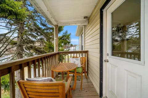 a view of balcony with furniture