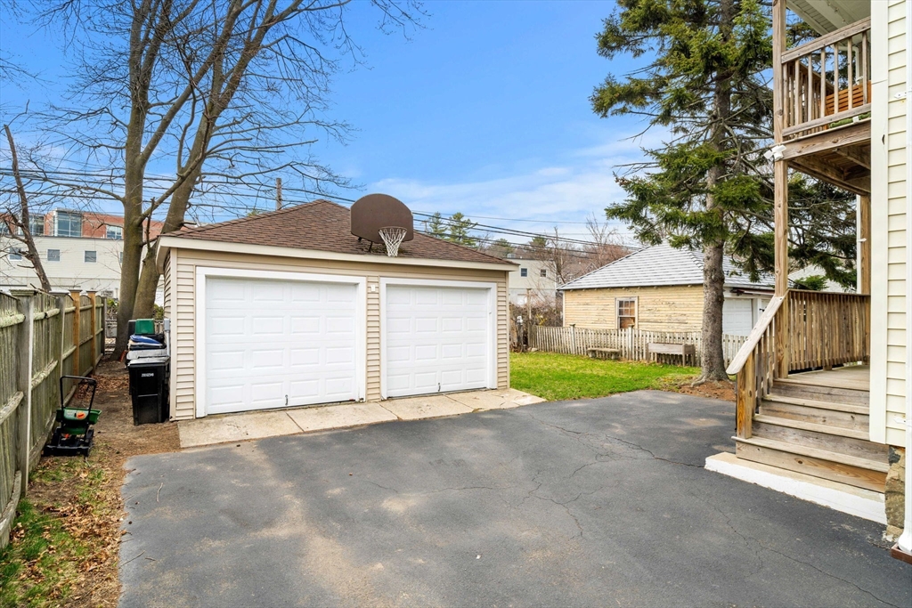 104 Stetson Avenue, Unit 2 Swampscott, MA 01907 - Photo 30 of 33 a view of a house with a yard and garage