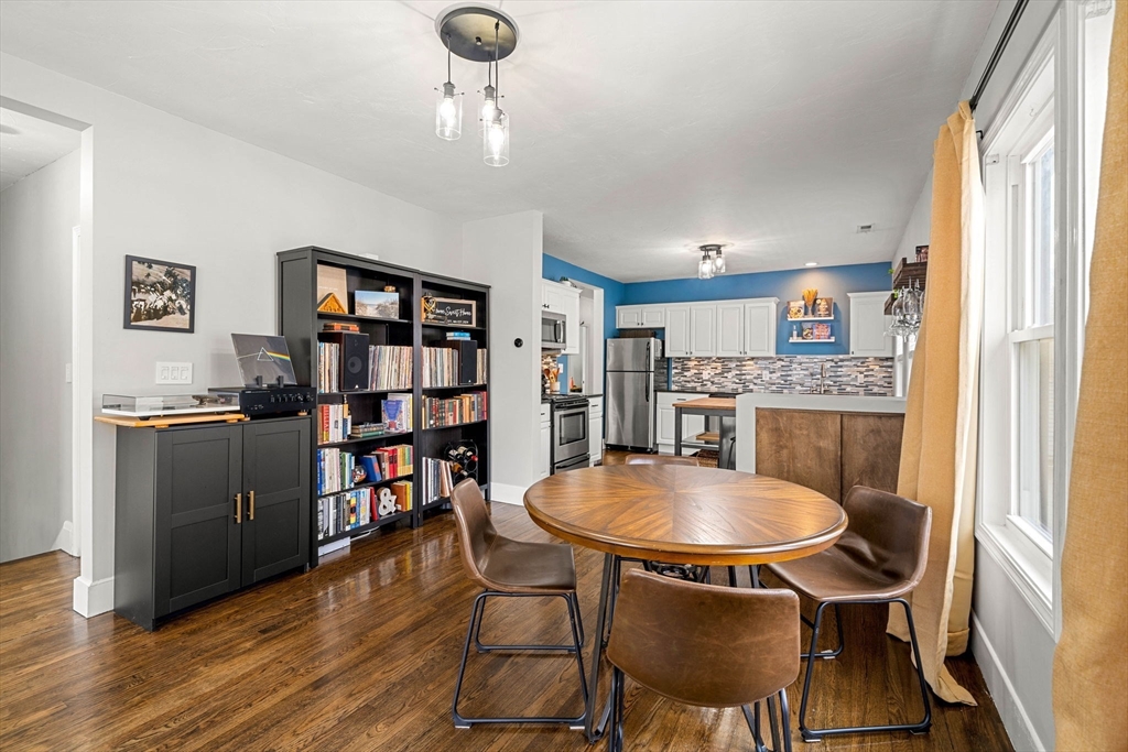 104 Stetson Avenue, Unit 2 Swampscott, MA 01907 - Photo 9 of 33 a view of a dining room with furniture and wooden floor