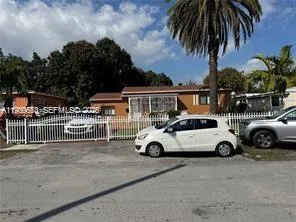 a view of parking with cars parked