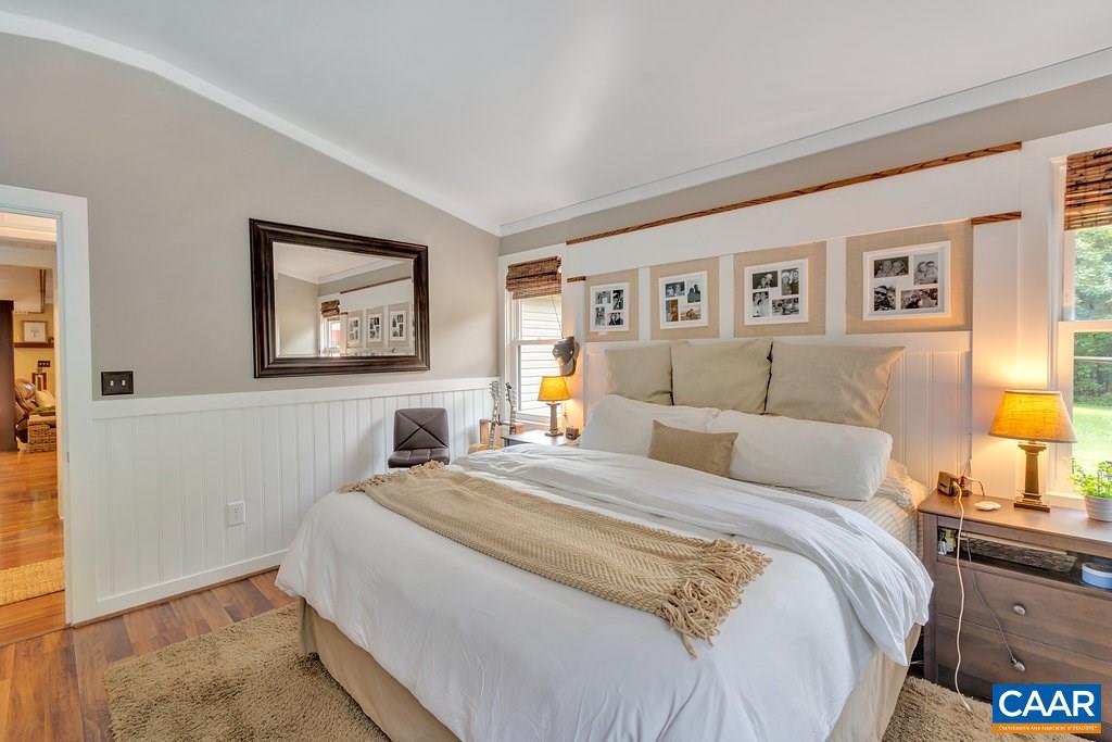 2523 Ridge Road Palmyra, VA 22963 - Photo 22 of 44 a bedroom with a bed and a lamp on dresser
