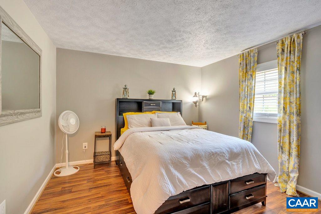 2523 Ridge Road Palmyra, VA 22963 - Photo 26 of 44 a bedroom with a bed and a night stand