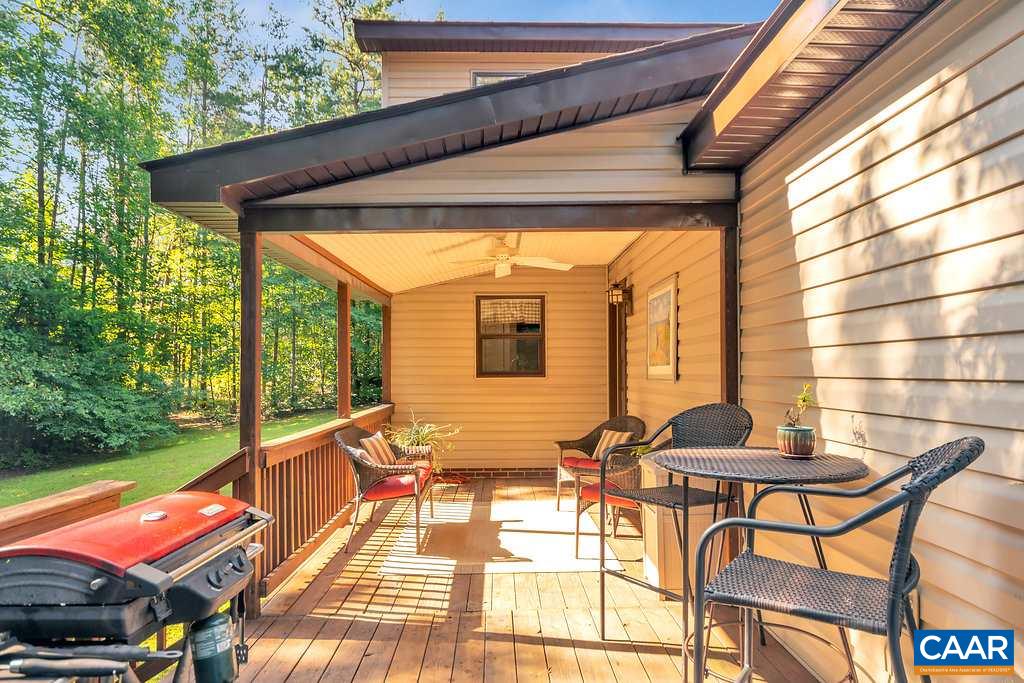 2523 Ridge Road Palmyra, VA 22963 - Photo 35 of 44 a outdoor space with patio the couches and chairs with a floor to ceiling window plants and trees