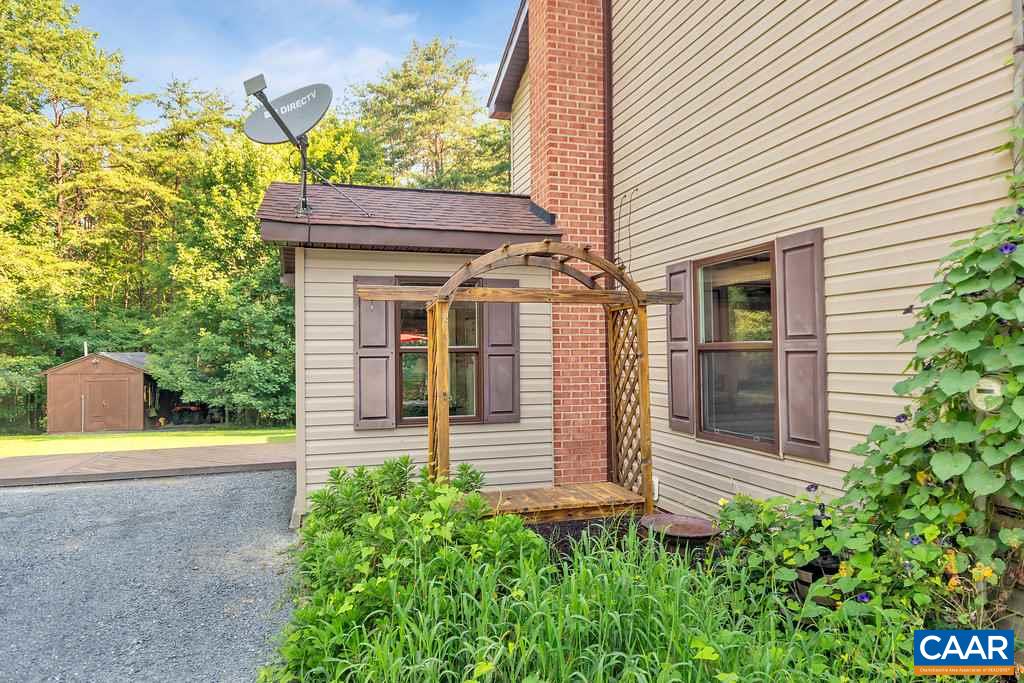 2523 Ridge Road Palmyra, VA 22963 - Photo 42 of 44 a front view of a house with garden