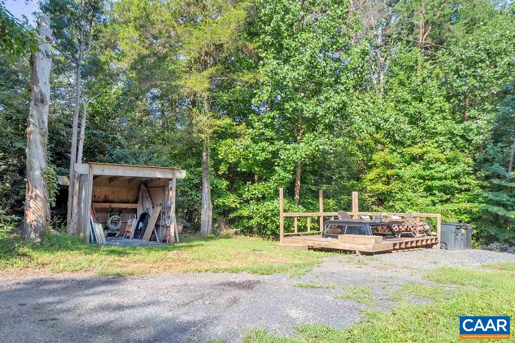2523 Ridge Road Palmyra, VA 22963 - Photo 43 of 44 a view of a backyard with a patio and a garden