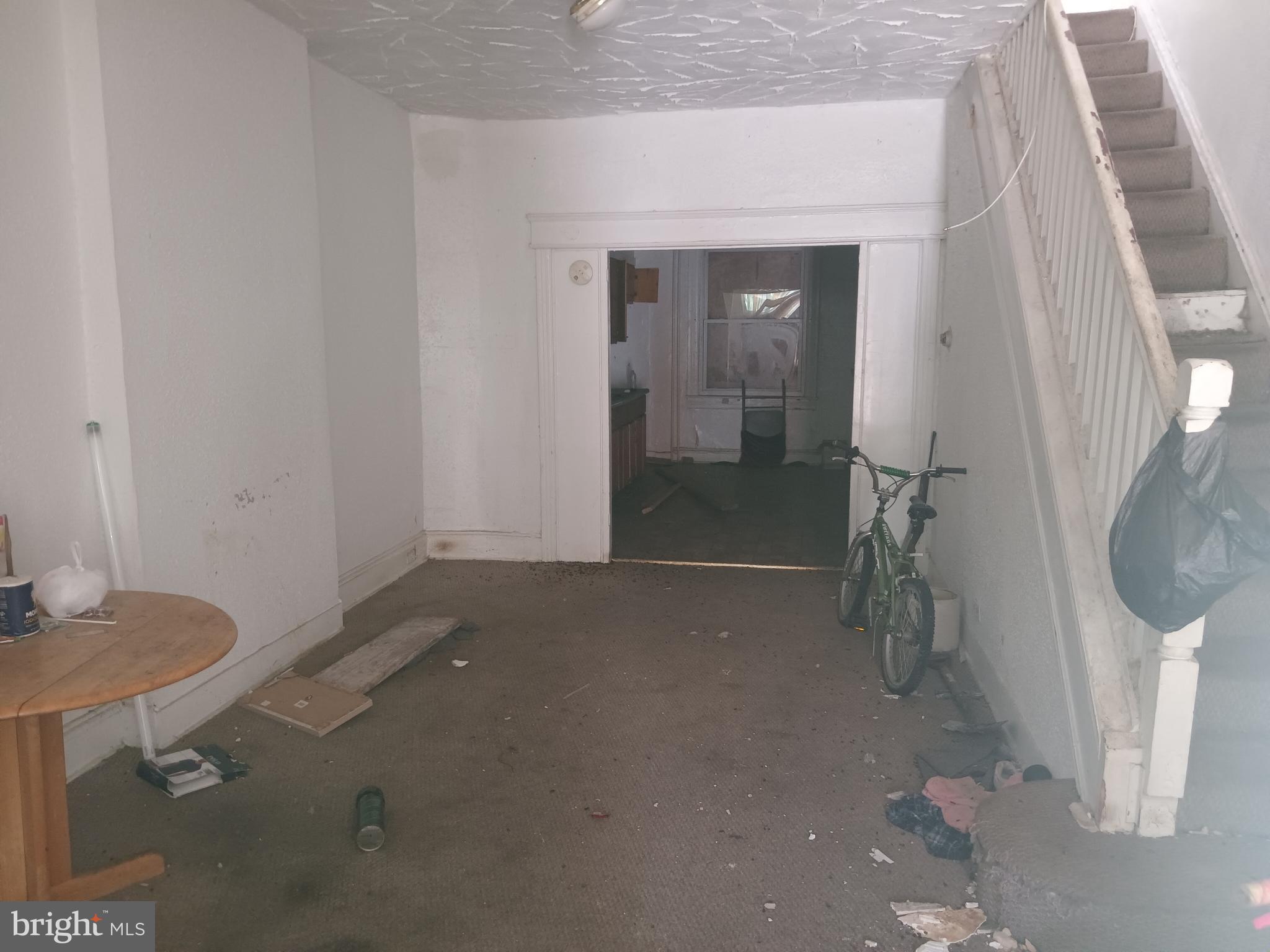 2414 East Oliver Street Baltimore, MD 21213 - Photo 2 of 9 a room with a table and a chair