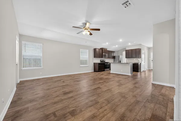a view of a kitchen with a sink and a fireplace