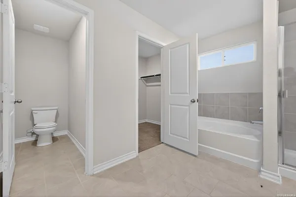 a bathroom with a bathtub and a toilet