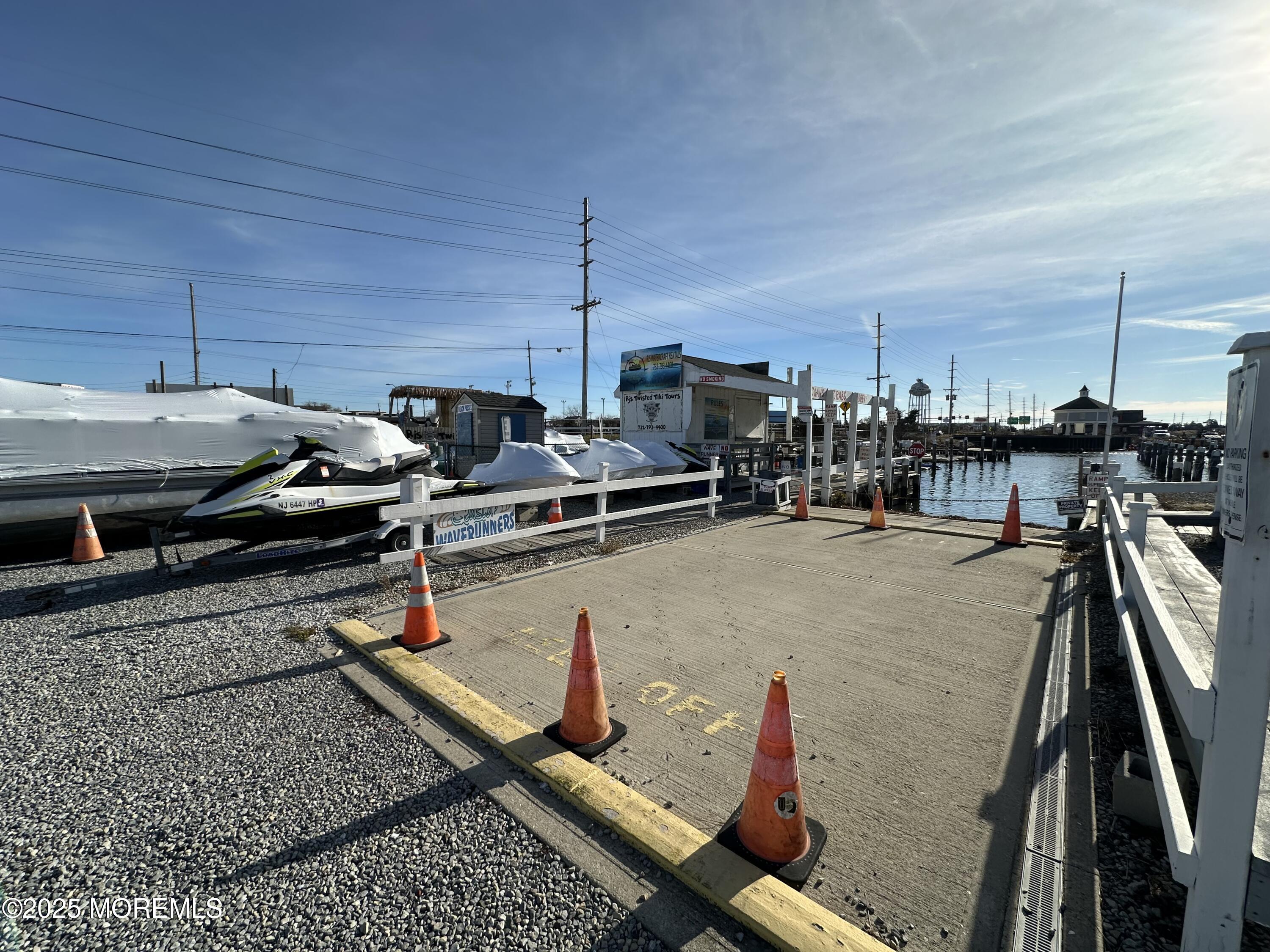 Bayside Terrace Seaside Heights, NJ 08751 - Photo 12 of 13 a roof deck with table and chairs