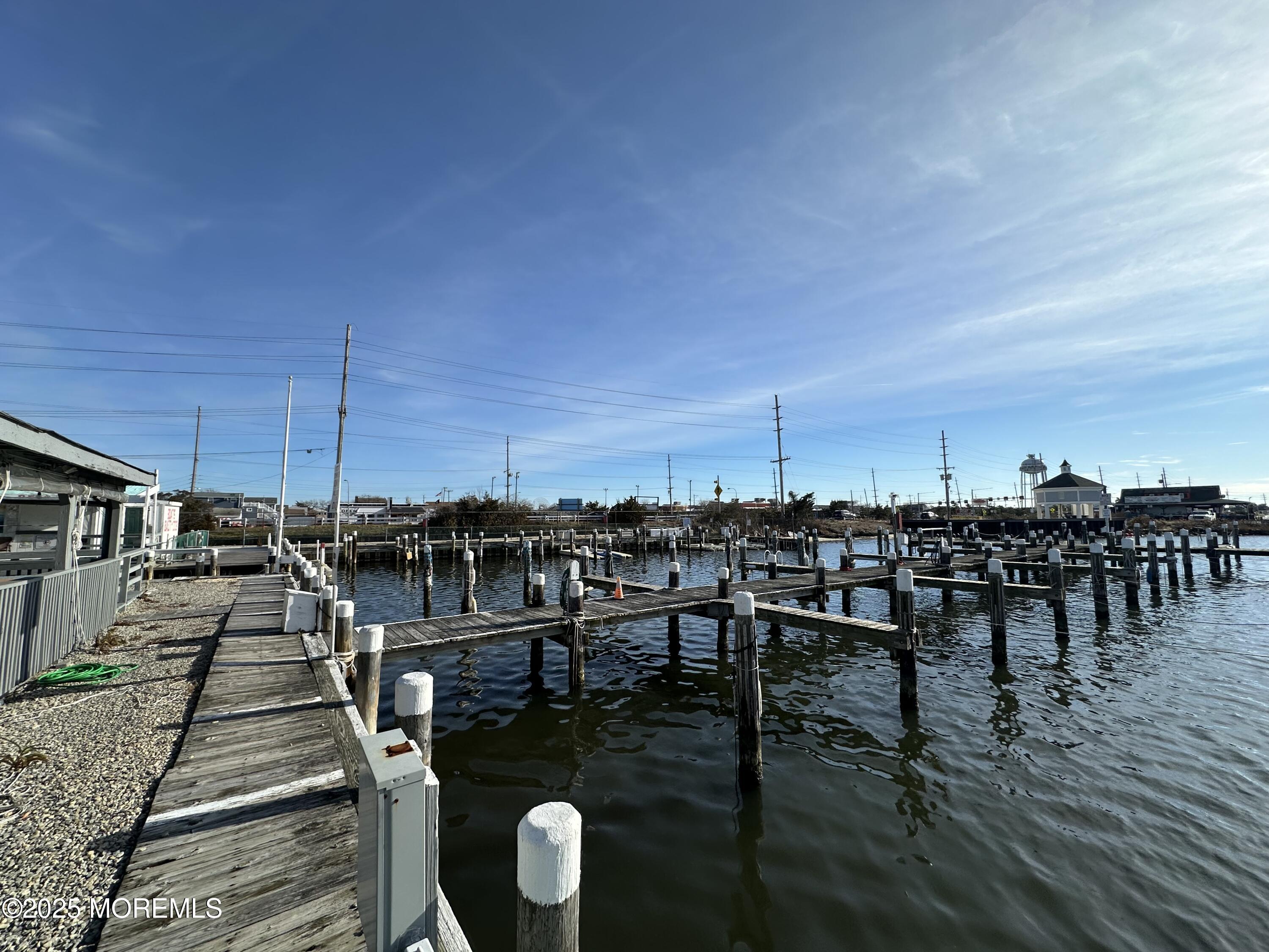 Bayside Terrace Seaside Heights, NJ 08751 - Photo 3 of 13 a view of a chairs and table on wooden floor