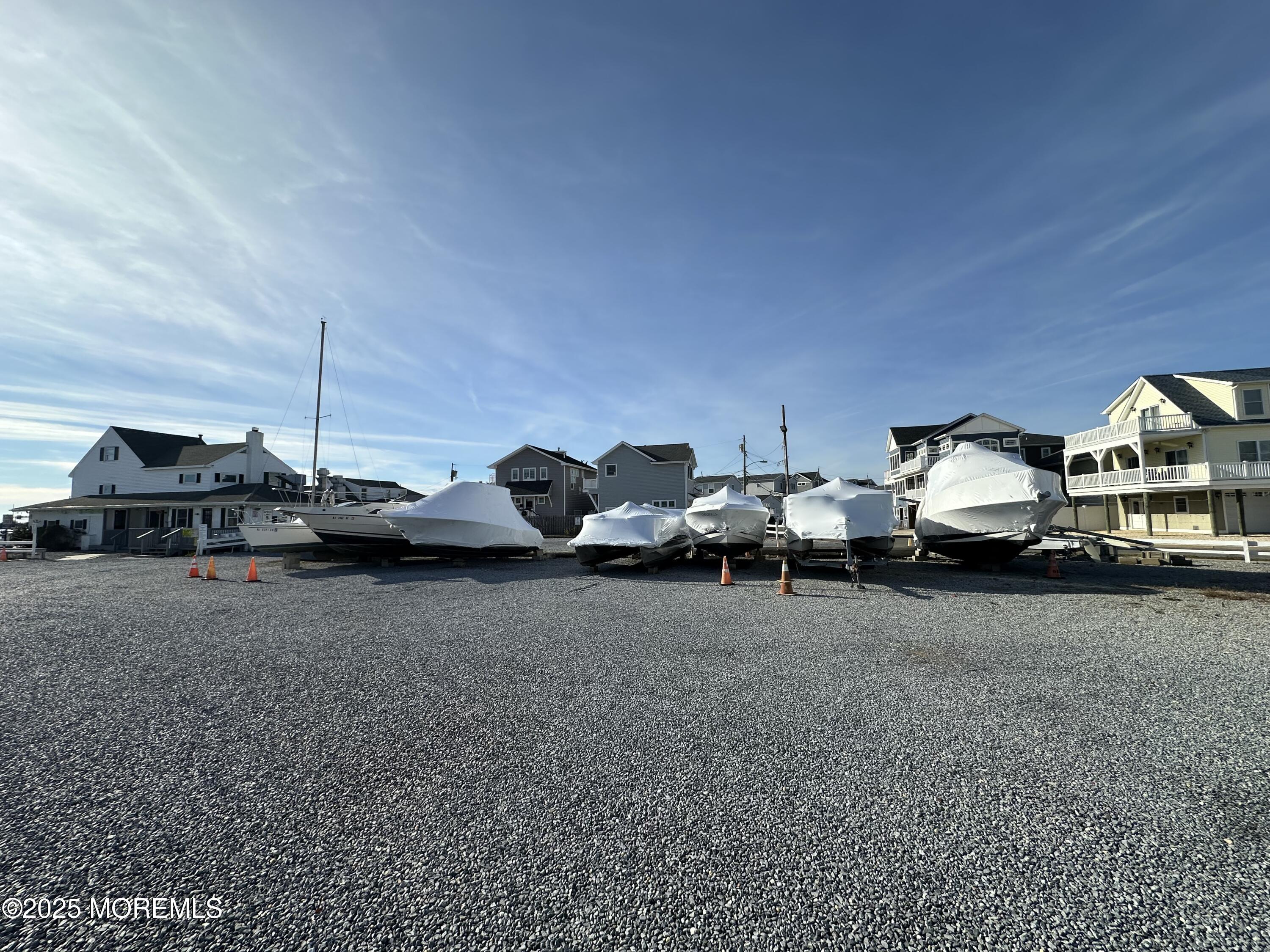Bayside Terrace Seaside Heights, NJ 08751 - Photo 10 of 13 a car parked in parking area of a house