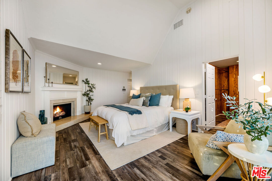 26174 Pacific Coast Highway Malibu, CA 90265 - Photo 14 of 33 a living room with furniture a fireplace and a potted plant