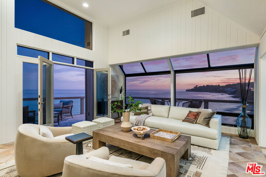 26174 Pacific Coast Highway Malibu, CA 90265 - Photo 20 of 33 a living room with furniture and a large window