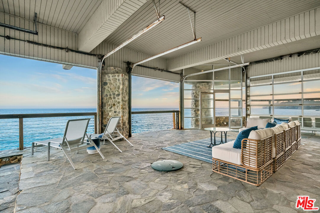 26174 Pacific Coast Highway Malibu, CA 90265 - Photo 26 of 33 a living room with couch and a table