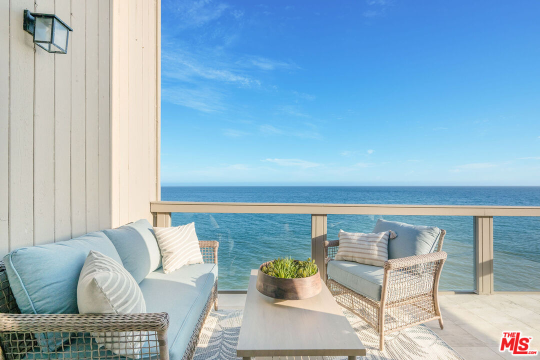 26174 Pacific Coast Highway Malibu, CA 90265 - Photo 8 of 33 a living room with furniture and wooden floor