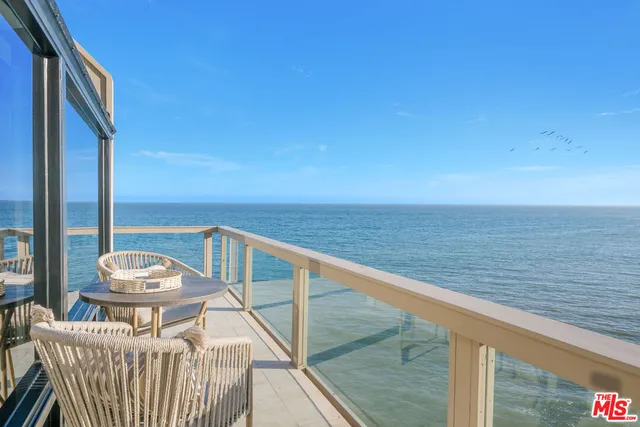 a view of a balcony with an ocean view
