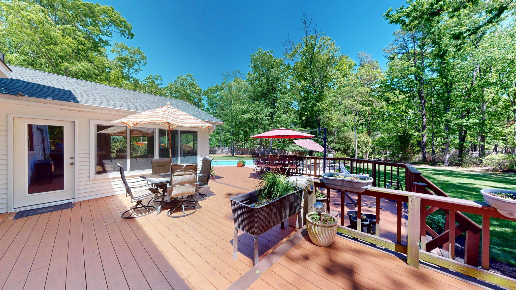 3 Colonial Court Medford, NJ 08055 - Photo 72 of 89 Serene deck surrounded by lush greenery.