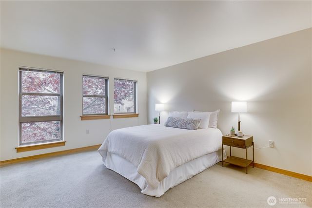 a bedroom with a bed and window