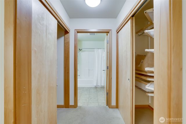 a view of a bathroom from a hallway