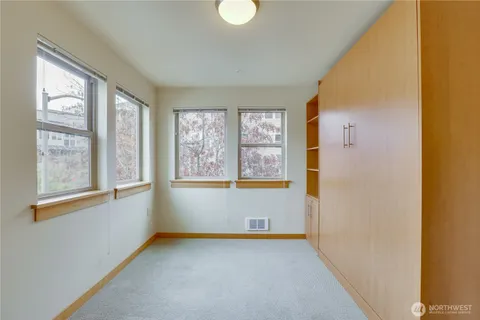 a view of an empty room with windows