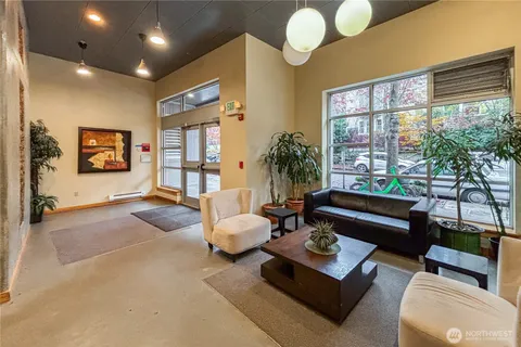 a living room with furniture and a large window