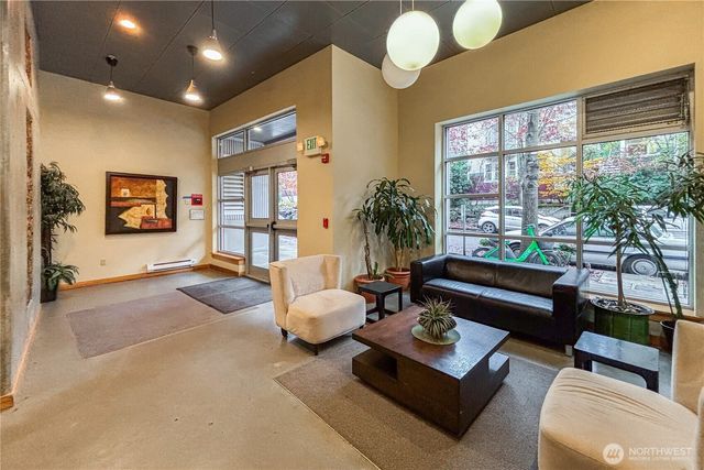 a living room with furniture and a large window