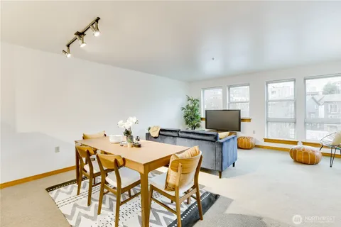 a dining room with a table and chairs