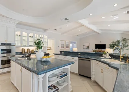 a kitchen with counter top space appliances and cabinets