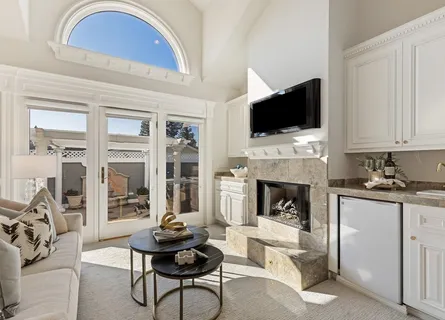 a bathroom with a granite countertop sink and a window