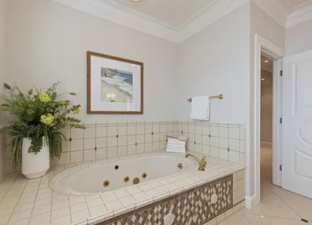 a stove top oven sitting inside of a kitchen