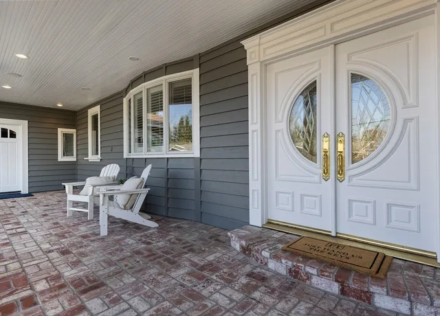 a front view of a house with garden