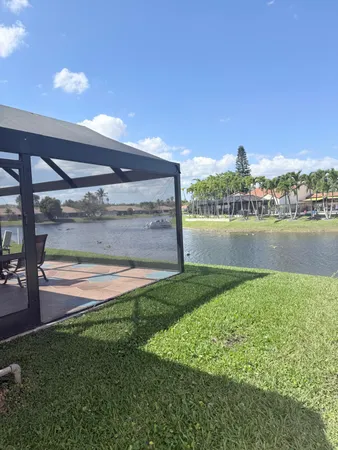 a view of a lake with a big yard