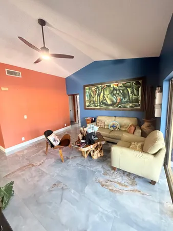 a living room with furniture window and rug