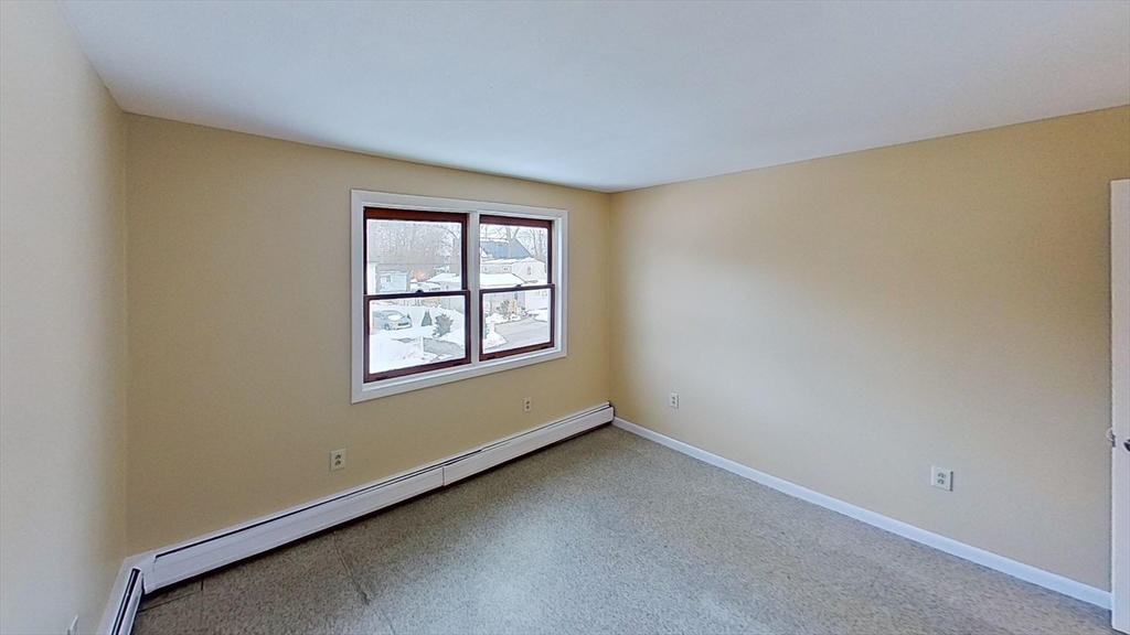 52 Rockefeller Street, Unit 2 Randolph, MA 02368 - Photo 5 of 9 an empty room with a window